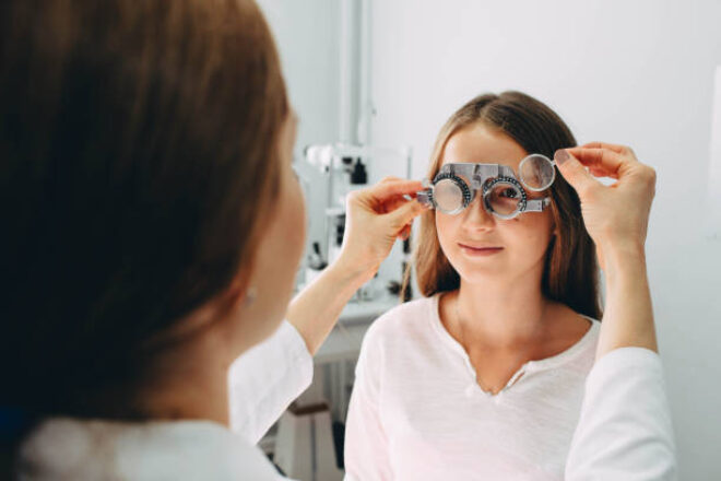 Teenager eye doctor stock image