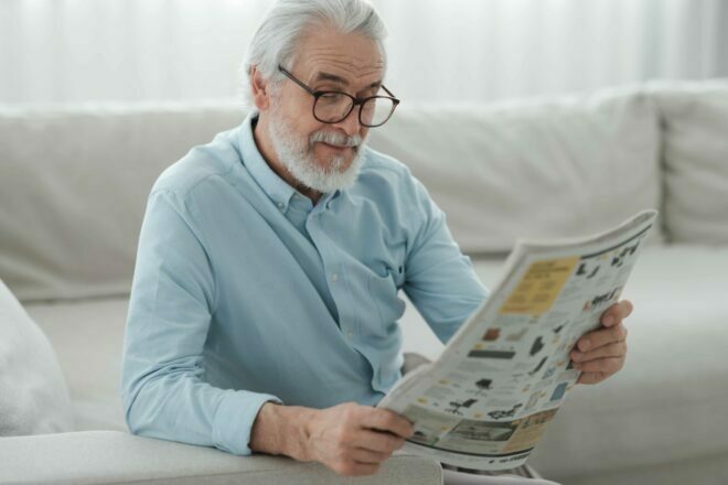Man reading newspaper april blog
